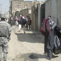 Families return home with their one bag of supplies